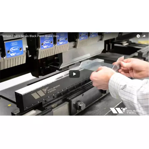 Operator Hand Bending Metal Sample Near Press bake Image