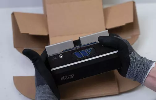 eClamp Body Being Taken out of a Brown Box