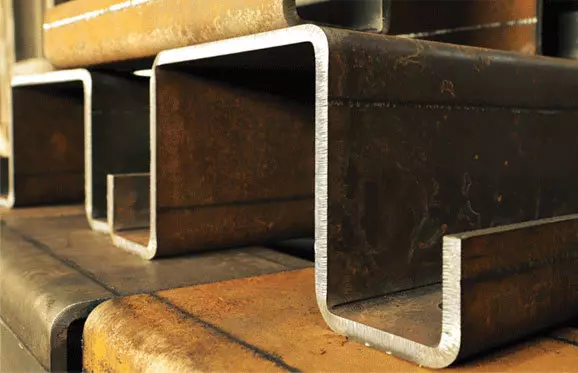 stacks of bent thick metal pieces 