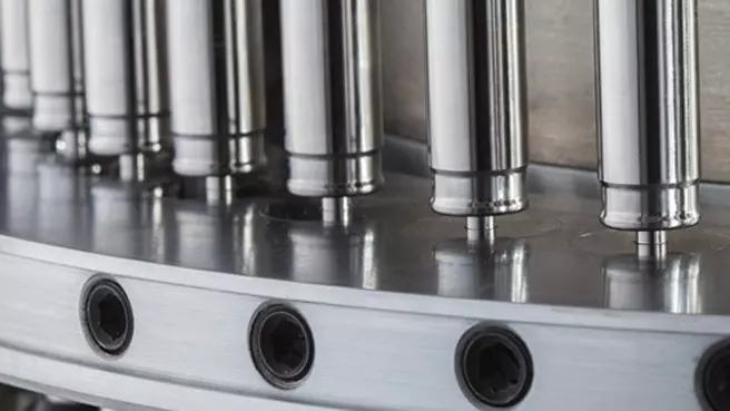 close up image of tablet tooling in a tablet press