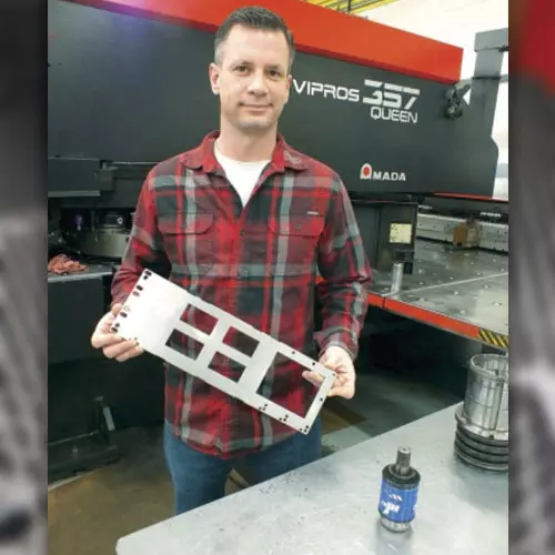 Operator Holding Metal Sample Image