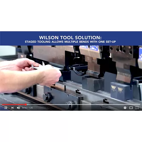 Hands Bending Metal in a Staged Tooling Setup Image